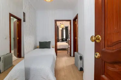 a green cabinet with a microwave on top of it at Renovated Feb25 Clerigos Cozy Balcony with self check in in Porto
