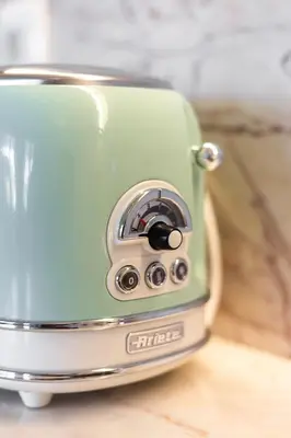 a toaster sitting on top of a wooden table at DA'HOME - Rola Art Work Studio in Porto