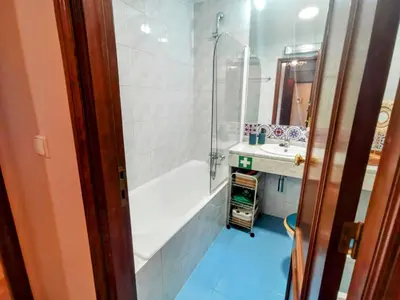 a bathroom with a shower and a tub and a sink at Coronel Pacheco 42 - Porto in Porto