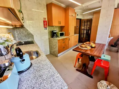 a kitchen with a table with food on it at Coronel Pacheco 42 - Porto in Porto