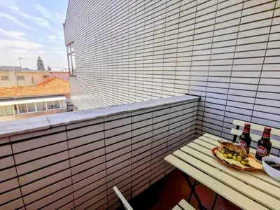 a table with a plate of food and drinks on a balcony at Coronel Pacheco 42 - Porto in Porto