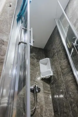 a bathroom with a shower with a toilet in it at House Romantic II in Porto