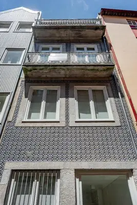 a tall building with windows on the side of it at Decompress at a Tranquil, Minimal Urban Oasis with an Edge in Porto