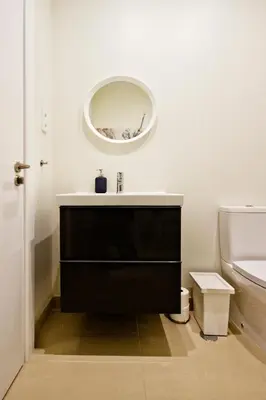 a bathroom with a sink and a mirror on the wall at Ribeira - Dixos Oporto Apartments III in Porto