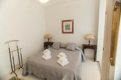a bedroom with a bed with towels on it at Sweet Bainharia by Porto City Hosts in Porto