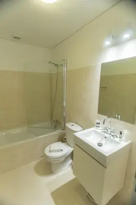 a bathroom with a toilet and a sink and a shower at Sweet Bainharia by Porto City Hosts in Porto