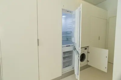 a white refrigerator with a washing machine in it at Sweet Bainharia by Porto City Hosts in Porto