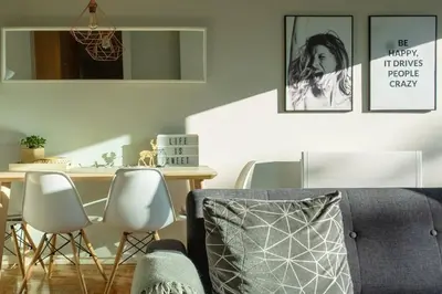 a living room with a table and chairs and a couch at Virtudes Terrace in Porto