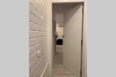 a hallway with a door leading to a closet at City Heart Place 3 in Porto