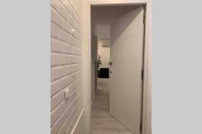 a hallway with a door leading to a closet at City Heart Place 3 in Porto