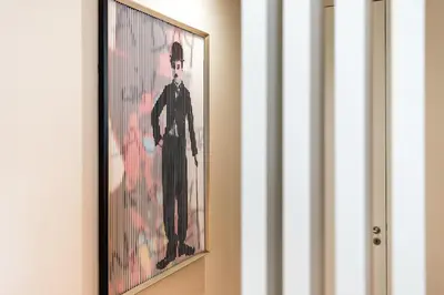 a picture of a man in a suit on a wall at Vintage Luxury House in Porto