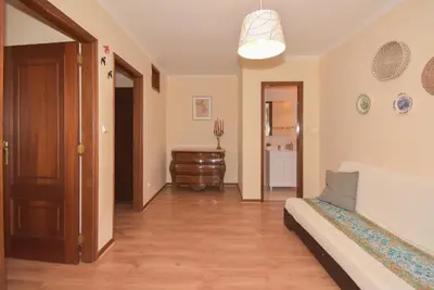 a living room with a bed and a hallway at Porto Downtown River in Porto