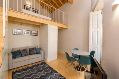 a living room with a couch and a table at Morar Apartments Porto in Porto