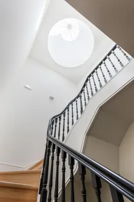a spiral staircase with a white ceiling at Wine Luxury House in Porto