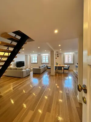 a large living room with a wooden floor at Oportoflag center in Porto