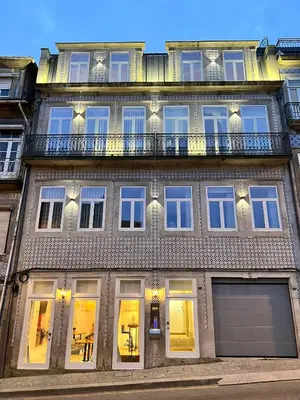 a large building with windows and a balcony at Oportoflag center in Porto