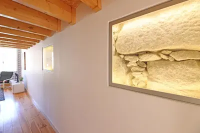 a painting hangs on the wall of a room at FLH Porto City Mezzanine Apartment in Porto