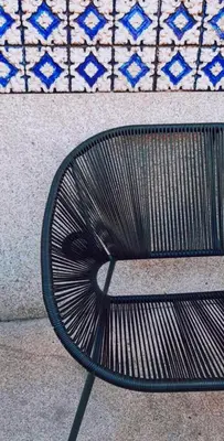 a bench sitting in front of a wall at Gallery Townhouse & Home in Porto