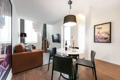a living room with a table and a couch at Marques Design Apartments in Porto