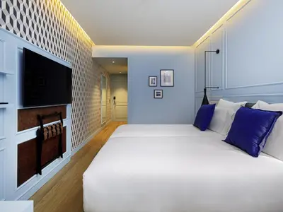 a white bathroom with a sink and a shower at Mercure Porto Centro Aliados in Porto