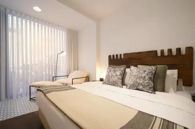 a bedroom with a large bed and a window at Stayin Apartments - Rua do Sol in Porto