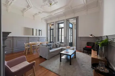 a living room with a couch and a table at Porto Garden Villa in Porto