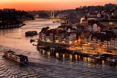 a view of a river with buildings and a city at Moreira 284 in Porto