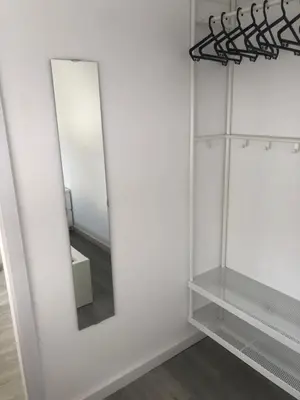 a bathroom with two mirrors on a wall at Moreira 284 in Porto