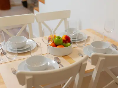 a table with a bowl of fruit on it at Ponte D Luis I Apartments in Porto