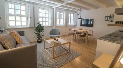 a living room with a couch and a table at Souto Apartments in Porto