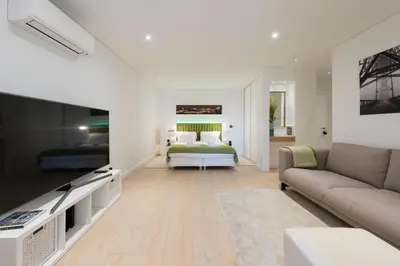 a living room with a bed and a couch at Heart of D. Pedro Apartments III in Porto