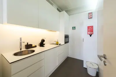 a bathroom with a sink and a toilet at Cedofeita Premium Apartment 1F in Porto