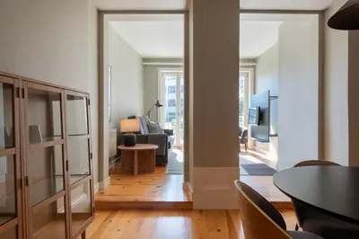 a living room with a couch and a table at Cedofeita Premium Apartment 1B in Porto