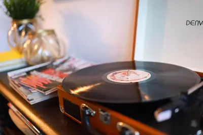 a vinyl record sitting on top of a table at Art District - POP & ROCK Apartments in Porto