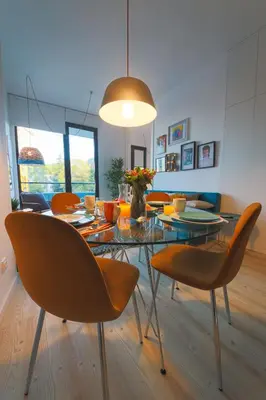 a dining room with a glass table and chairs at Art District - POP & ROCK Apartments in Porto