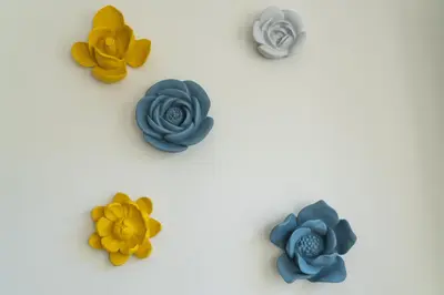 a group of plastic flowers on a white background at Kings Oporto Apartments in Porto