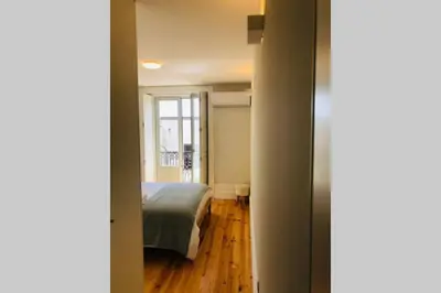 a bedroom with a bed and a window at CL Freixo Apartment in Porto