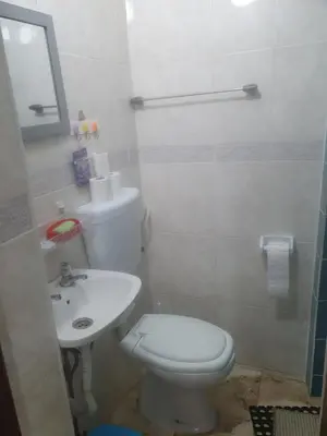 a bathroom with a white toilet and a sink at Truz truz2 in Porto