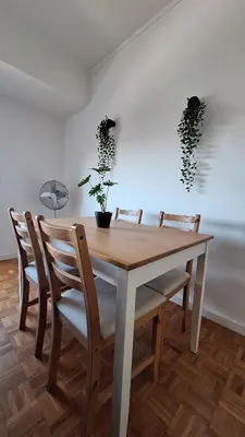 a white bedroom with a bed and a mirror at Apartamentos Jardim do Morro in Vila Nova de Gaia
