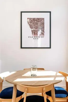 a wooden table with a wine glass on top of it at Bruno's Wine House in Vila Nova de Gaia