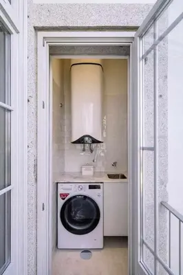 a kitchen with a washing machine and a stove at Bruno's Wine House in Vila Nova de Gaia