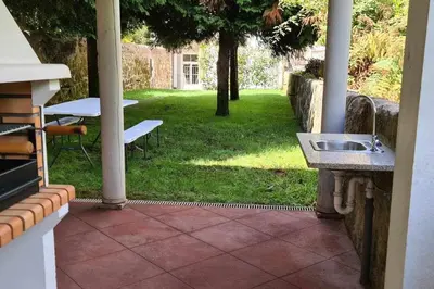 a patio with a sink and a table in a yard at Bruno's Wine House in Vila Nova de Gaia