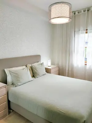a bedroom with a large bed with white sheets at Porto Santa Catarina - Apartment with Terrace in Porto