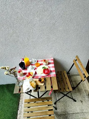 a picnic table with a plate of food on it at Porto Historic - Apartment with Private Patio in Porto