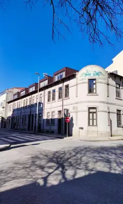 a white building with a dome on a street at Porto Unique - Apartment with Private Patio in Porto
