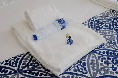 a water bottle sitting on top of a towel at BOUTIQUE Rentals-Flores Terrace historical centre in Porto