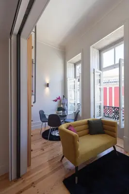 a living room with a couch and a table at Fashion Luxury House in Porto