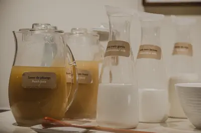 a group of glass jars and bottles of milk at Vilar Oporto Hotel in Porto