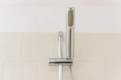 a chrome kitchen sink faucet in a bathroom at GuestReady - Coral Apartment in Porto