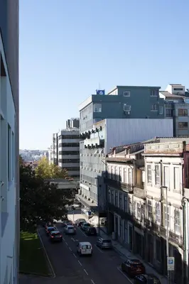 a view of a city street with cars on the road at Spot Apartments in Porto